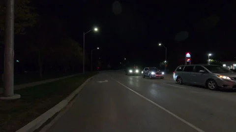 POV driving plate reverse rear view show on a very dark night on the streets Stockbeeldmateriaal 153330476