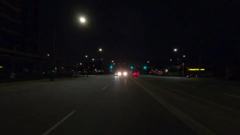 POV driving plate reverse rear view show on a very dark night on the streets Stock-Footage 153333500