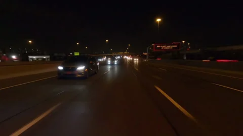 POV driving plate reverse shot roads and highways on a very dark night 스톡 동영상 155894262