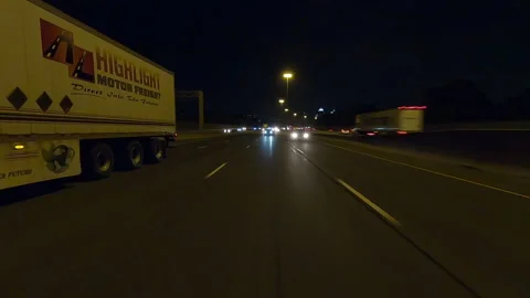 POV driving plate reverse shot roads and highways on a very dark night Stock Footage 155895988