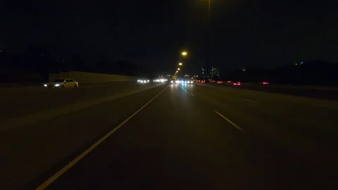 POV driving plate reverse shot roads and highways on a very dark night Vídeo Stock 155896389