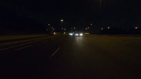 POV driving plate reverse shot roads and highways on a very dark night 스톡 동영상 155897336