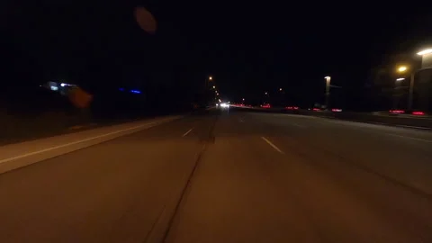 POV driving plate reverse shot roads and highways on a very dark night Stockbeeldmateriaal 155898507