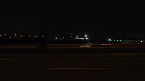 POV driving plate side view city streets on a dark night Stockbeeldmateriaal 149459900