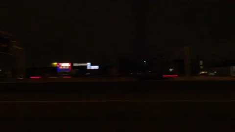 POV driving plate side view city streets on a dark night Video stock 149460203