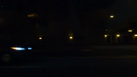 POV driving plate side view city streets on a dark night Stock Footage 149460254