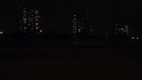 POV driving plate side view city streets on a dark night Stockbeeldmateriaal 149460903