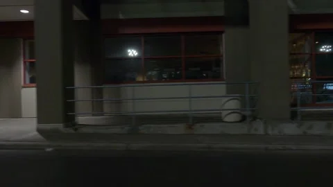 POV driving plate side view of closed retail stores at night in COVID lockdown Video stock 149464669