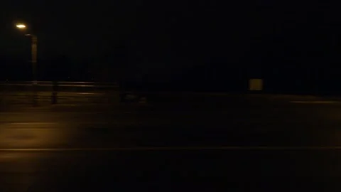 POV driving plate with side view on dark city streets at night with car traffic Stock Footage 149467000