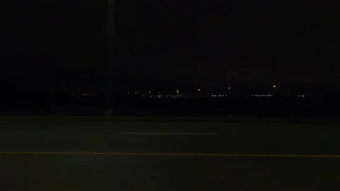 POV driving plate with side view on dark city streets at night with car traffic Stock Footage 149467500