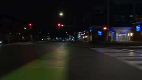 POV driving plate with side view on dark city streets at night with buildings Video stock 149467647