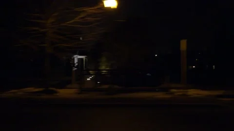POV driving plate with side view on dark city streets at night with buildings Stock Footage 149470335