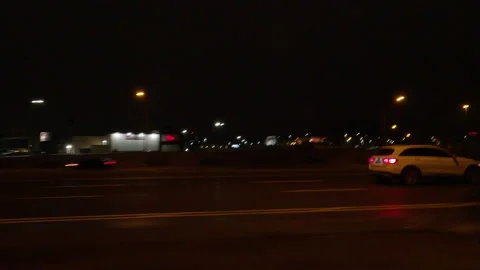 POV driving plate side view on dark city streets at night Video stock 149729867