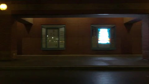 POV driving plate side view of closed retail stores at night in COVID lockdown Vídeo Stock 149759725