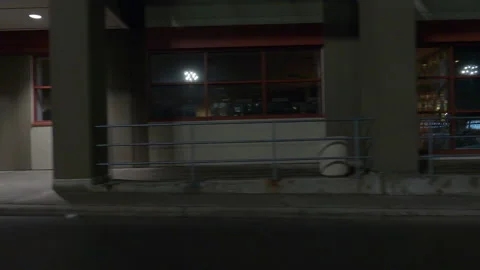 POV driving plate side view of closed retail stores at night in COVID lockdown Vídeos de archivo 149762308