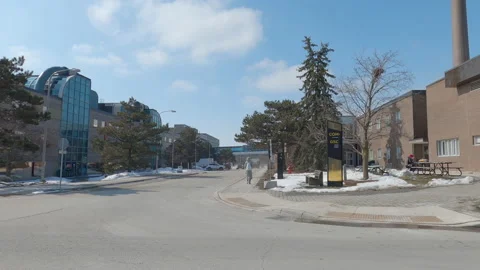 POV driving plate side view of empty university campus in COVID pandemic Stock Footage 149910627