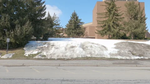 POV driving plate side view of empty university campus in COVID pandemic Vidéo 149925169