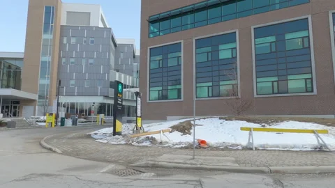POV driving plate side view of empty university campus in COVID pandemic 動画素材 149927262