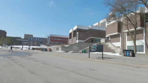 POV driving plate side view of empty university campus in COVID pandemic Video stock 149933905