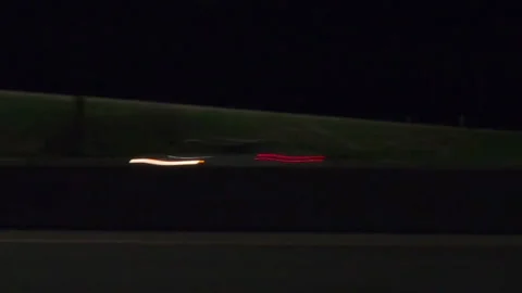 POV driving plate side view city streets on a very dark night Stock-Footage 154219911