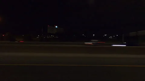 POV driving plate side view city streets on a very dark night Видео 154221365