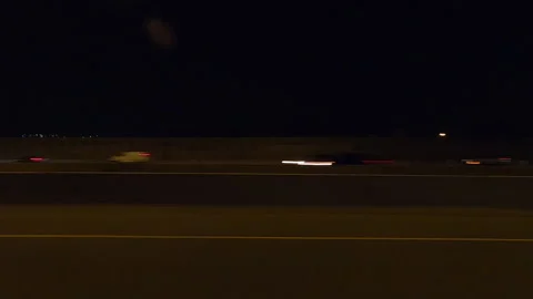 POV driving plate side view city streets on a very dark night Видео 154221670