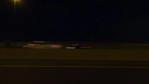 POV driving plate side view city streets on a very dark night Stock Footage 154221988