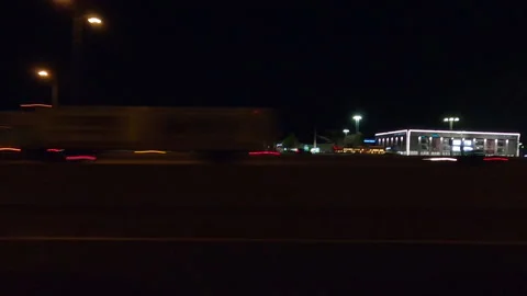 POV driving plate side view city streets on a very dark night Vídeo Stock 154222271