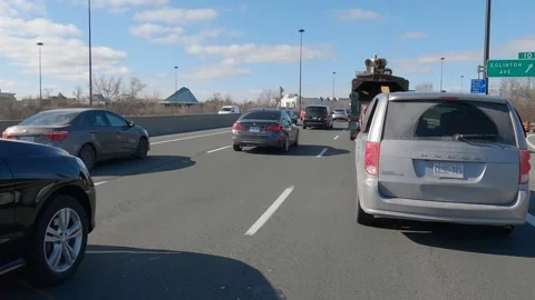 POV driving plate slow moving rush hour car traffic on highway Vídeos de archivo 151496953