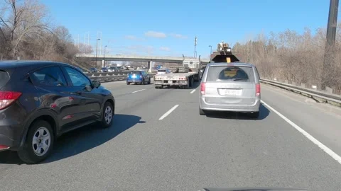 POV driving plate slow moving rush hour car traffic on highway Stock Footage 151497103