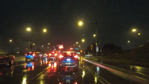 POV driving in rain on dark wet Toronto downtown city streets in poor visibility Stock Footage 146707635