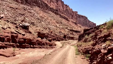POV Driving on Remote Dirt Road Through Red Rock Canyon in Utah Desert Land.. Stock Footage 330762161