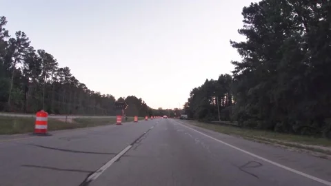 POV driving road bridge construction zone speed limit 45 early morning Stock-Footage 194020579