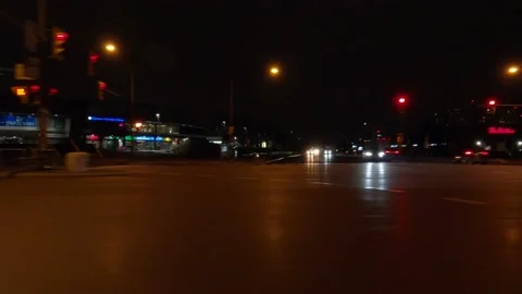 POV driving side view on dark city streets at night 動画素材 149471808