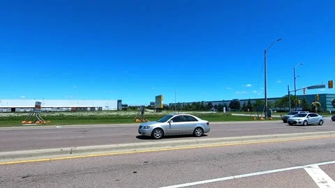 POV driving side view highway traffic with cars and deep blue skies Stock Footage 187348862
