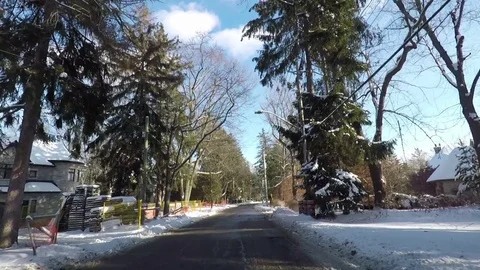 POV Driving in the suburbs on a cold winter day with snow on the ground  Stock Footage 83826563