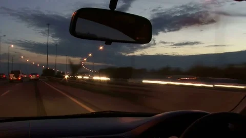 POV Driving at sunset / dusk Time-Lapse. Highway. UK - right side driving Stock Footage 78735561