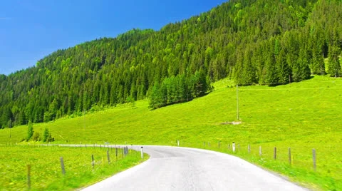 POV, driving through alpine fields. Stock-Footage 26377612