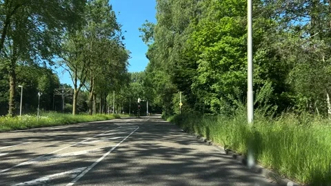 POV Driving Through Amsterdam Suburbs with Residential Areas and Dutch Roads Stock-Footage 337048729