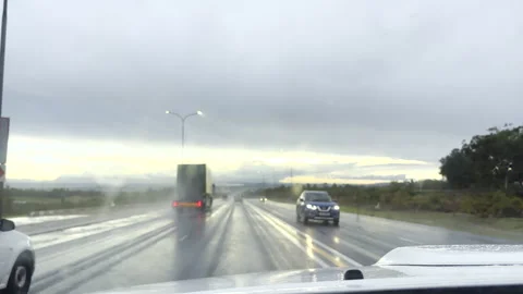 POV driving through car windscreen on a wet highway during rainy conditions Stock Footage 337430083