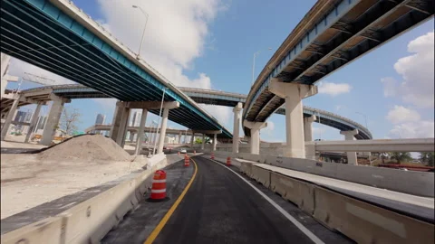 POV of Driving through a complex urban highway interchange beneath multiple Stock-Footage 326087592