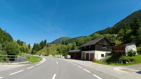 POV driving through idyllic alpine village in Austria Stock Footage 246640838