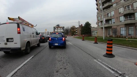 POV driving through road construction on city streets Stock Footage 98436432
