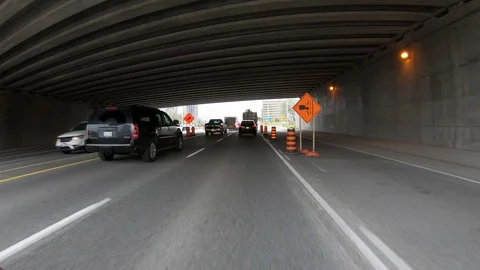 POV driving through road construction on city streets Stock Footage 98437771