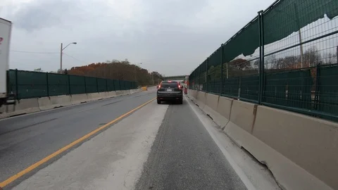 POV driving through road construction on city streets Stock Footage 98438256