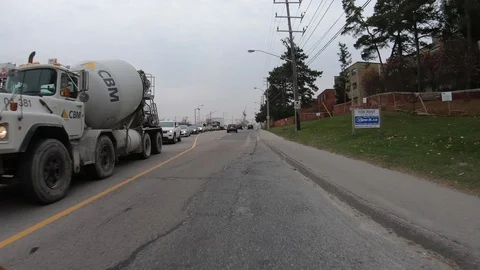 POV driving through road construction on city streets Stock Footage 98439042
