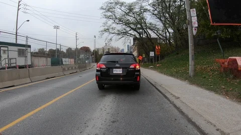 POV driving through road construction on city streets Stock Footage 98439988
