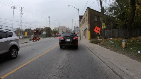 POV driving through road construction on city streets Stock Footage 98440410