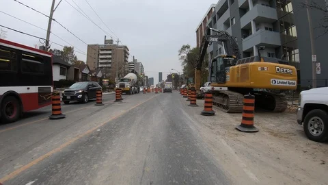 POV driving through road construction on city streets Stock Footage 98441216