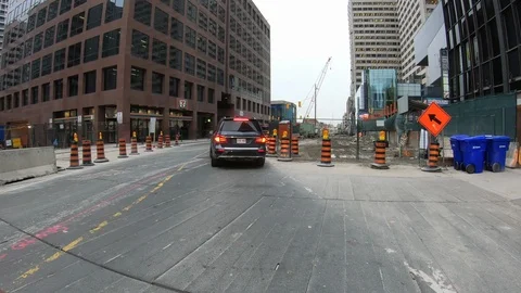 POV driving through road construction on city streets Stock Footage 98442235